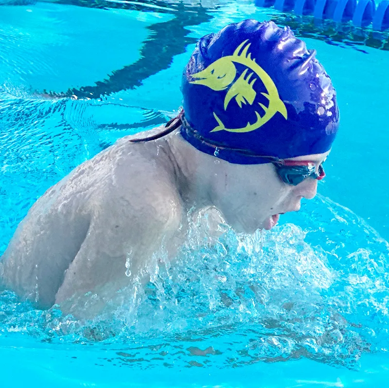 A Wahoos swimmer doing breaststroke